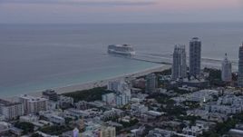 6.7K aerial stock footage a cruise ship sailing near South Beach at sunset, Miami, Florida Aerial Stock Footage | AX0172_195