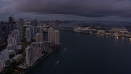 6.7K aerial stock footage reverse view of Brickell Key and Downtown Miami skyscrapers at twilight, Florida Aerial Stock Footage | AX0172_207