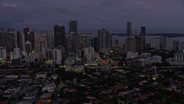 6.7K aerial stock footage of flying past Downtown Miami skyscrapers at twilight, Florida Aerial Stock Footage | AX0172_211