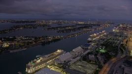 6.7K aerial stock footage of pan from Jungle Island to cruise ships at Port of Miami at twilight, Florida Aerial Stock Footage | AX0172_214