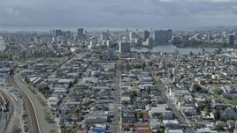 6K aerial stock footage tilt from the 880 freeway to reveal Lake Merritt and Downtown Oakland, California Aerial Stock Footage | AX0173_0005