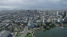 6K aerial stock footage of flying over Downtown Oakland toward Tribune Tower, California Aerial Stock Footage | AX0173_0007