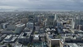 6K aerial stock footage of flying over Tribune Tower in Downtown Oakland toward urban neighborhoods, California Aerial Stock Footage | AX0173_0008