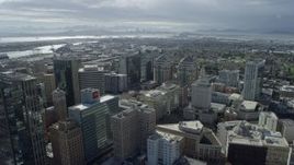 6K aerial stock footage fly over downtown office buildings toward Port of Oakland, California Aerial Stock Footage | AX0173_0016