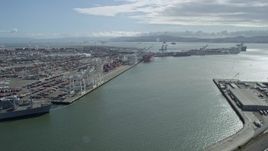 6K aerial stock footage of cargo cranes and containers at the Port of Oakland, California Aerial Stock Footage | AX0173_0028