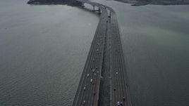6K aerial stock footage tilt from traffic for wider view of the Bay Bridge in Oakland, California Aerial Stock Footage | AX0173_0030