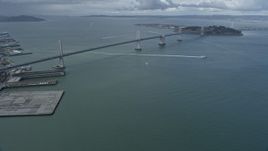 6K aerial stock footage a reverse view of the Bay Bridge, San Francisco Bay, California Aerial Stock Footage | AX0173_0043