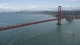 6K aerial stock footage of flying by the iconic Golden Gate Bridge, the city's skyline in the background, San Francisco, California Aerial Stock Footage | AX0173_0057