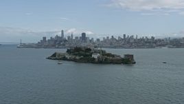 6K aerial stock footage orbit historic Alcatraz prison, reveal San Francisco skyline, California Aerial Stock Footage | AX0173_0085
