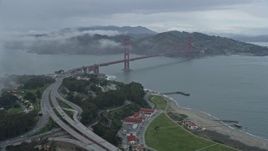6K aerial stock footage fly through a fog bank to reveal the Golden Gate Bridge, California Aerial Stock Footage | AX0173_0096