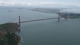 6K aerial stock footage of flying over fog above Marin Headlands, reveal Golden Gate Bridge, California Aerial Stock Footage | AX0173_0100