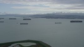 6K aerial stock footage of a wide view of cargo ships in San Francisco Bay, California Aerial Stock Footage | AX0173_0132