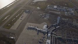 6K aerial stock footage of a bird's eye view of the control tower and terminals at Oakland Airport, California Aerial Stock Footage | AX0174_0002