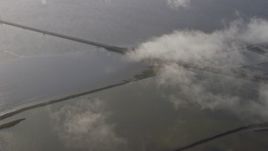 6K aerial stock footage of flying away from the San Mateo Bridge, Hayward, California Aerial Stock Footage | AX0174_0008