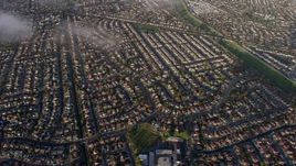 6K aerial stock footage of tilting to a bird's eye view of suburban neighborhoods in Union City, California Aerial Stock Footage | AX0174_0011