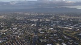 6K aerial stock footage of tilting from the 880 freeway in Milpitas to reveal Downtown San Jose in the distance, California Aerial Stock Footage | AX0174_0020