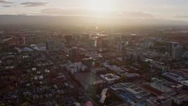 6K aerial stock footage of passing by Downtown San Jose at sunset, California Aerial Stock Footage | AX0174_0024