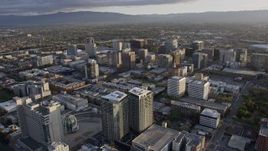 6K aerial stock footage of flying by office and apartment buildings in Downtown San Jose at sunset, California Aerial Stock Footage | AX0174_0027