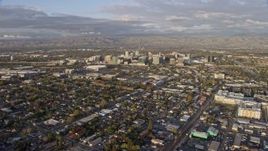 6K aerial stock footage of a stationary view of Downtown San Jose at sunset, California Aerial Stock Footage | AX0174_0035