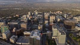 6K aerial stock footage of approaching and flying over office buildings in Downtown San Jose at sunset, California Aerial Stock Footage | AX0174_0038