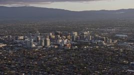 6K aerial stock footage of a wide view of city buildings in Downtown San Jose at sunset, California Aerial Stock Footage | AX0174_0041