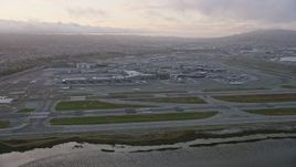 6K aerial stock footage of approaching San Francisco International Airport at sunset, California Aerial Stock Footage | AX0174_0066