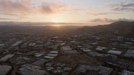 6K aerial stock footage of the setting sun behind South San Francisco office buildings, California Aerial Stock Footage | AX0174_0069