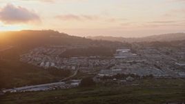 6K aerial stock footage of suburban neighborhood around the Cow Palace at sunset, Daly City, California Aerial Stock Footage | AX0174_0073