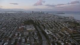 6K aerial stock footage of following 101 freeway toward the distant San Francisco skyline at sunset, California Aerial Stock Footage | AX0174_0077