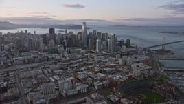 6K aerial stock footage of the San Francisco skyline seen from South of Market at sunset, California Aerial Stock Footage | AX0174_0080