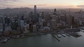 6K aerial stock footage of passing by Downtown San Francisco at sunset, California Aerial Stock Footage | AX0174_0083