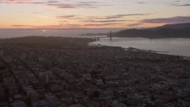 6K aerial stock footage of flying over the city toward the Golden Gate Bridge and setting sun, San Francisco, California Aerial Stock Footage | AX0174_0093