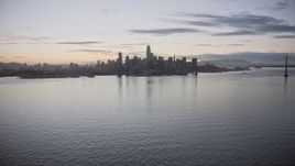 6K aerial stock footage of a wide view of the Downtown San Francisco skyline from the bay at twilight, California Aerial Stock Footage | AX0174_0102