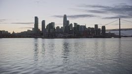 6K aerial stock footage fly toward Downtown San Francisco skyline from the bay at twilight, California Aerial Stock Footage | AX0174_0103