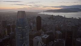 6K aerial stock footage fly over Downtown San Francisco toward distant Golden Gate Bridge at twilight, California Aerial Stock Footage | AX0174_0104