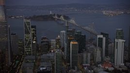 6K aerial stock footage of the Bay Bridge, seen from Downtown San Francisco at twilight, California Aerial Stock Footage | AX0174_0108