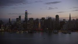 6K aerial stock footage the Downtown San Francisco skyline and Ferry Building at twilight, California Aerial Stock Footage | AX0174_0118