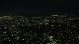 6K aerial stock footage of approaching Downtown Oakland and Lake Merritt at night, California Aerial Stock Footage | AX0174_0126