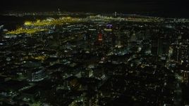 6K aerial stock footage of Tribune Tower and office buildings in Downtown Oakland at night, California Aerial Stock Footage | AX0174_0132