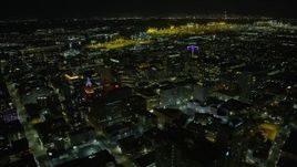 6K aerial stock footage fly over office buildings in Downtown Oakland, approach the port at night, California Aerial Stock Footage | AX0174_0135
