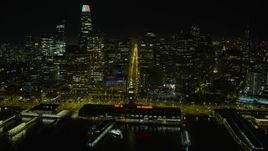 6K aerial stock footage fly over Ferry Building at night, follow Market Street through Downtown San Francisco, California Aerial Stock Footage | AX0174_0147