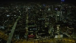 6K aerial stock footage of Downtown San Francisco skyscrapers near Bay Bridge at night, California Aerial Stock Footage | AX0174_0163