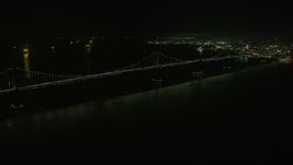 6K aerial stock footage pan to the Bay Bridge at night, San Francisco, California Aerial Stock Footage | AX0174_0195