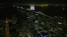 6K aerial stock footage of flying past downtown skyscrapers toward Bay Bridge at night, San Francisco, California Aerial Stock Footage | AX0174_0197