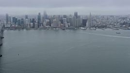 6K aerial stock footage of passing the Bay Bridge with a wide view of Downtown San Francisco, California Aerial Stock Footage | AX0175_0003