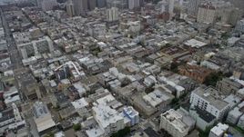 6K aerial stock footage of Nob Hill city and apartment buildings in San Francisco on a foggy day, California Aerial Stock Footage | AX0175_0010