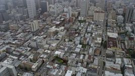 6K aerial stock footage of office and apartment buildings in Nob Hill and Chinatown, San Francisco on a foggy day, California Aerial Stock Footage | AX0175_0011