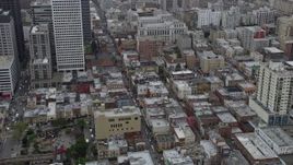 6K aerial stock footage orbit office and apartment buildings in Chinatown, San Francisco on a foggy day, California Aerial Stock Footage | AX0175_0013