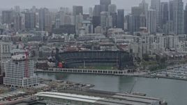 6K aerial stock footage of Oracle Park in San Francisco on a foggy day, California Aerial Stock Footage | AX0175_0019
