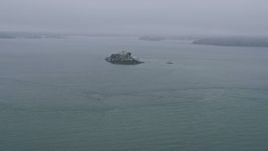 6K aerial stock footage approaching Alcatraz on a foggy day, California Aerial Stock Footage | AX0175_0023